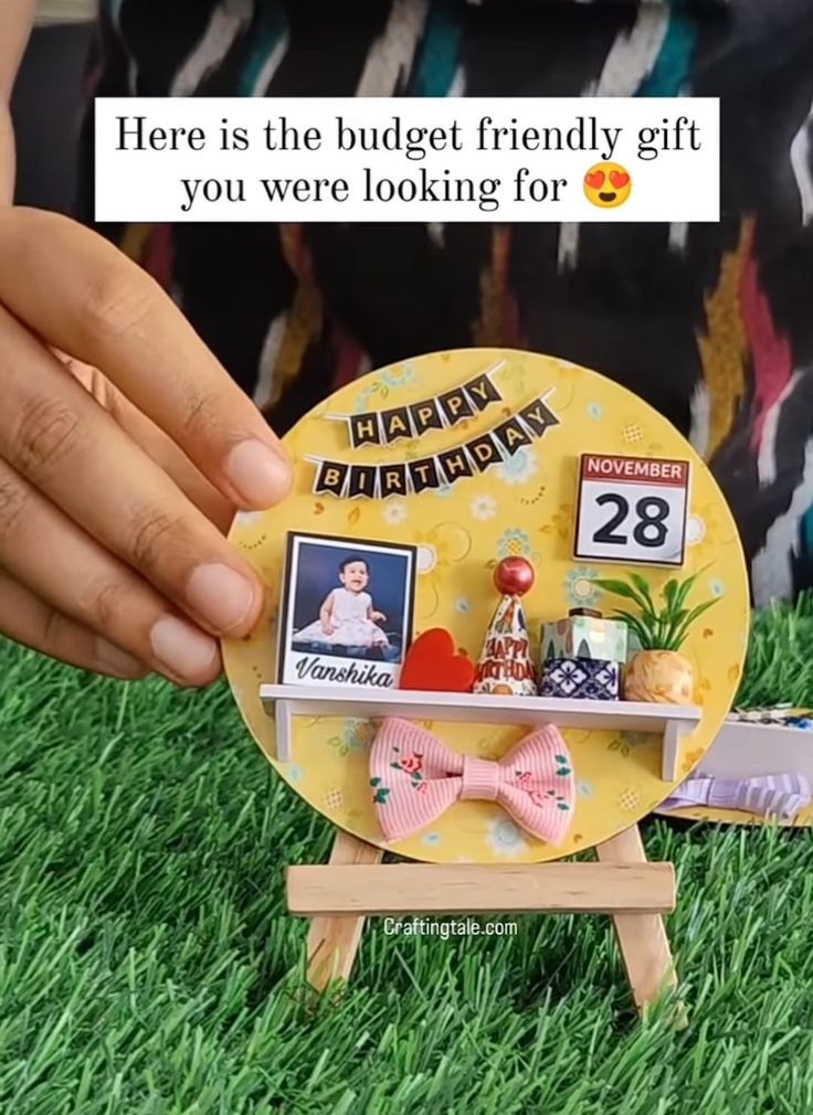 a person is holding a plate with pictures on it and the caption here is the budget friendly gift you were looking for