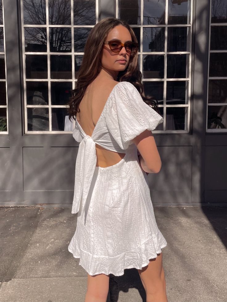 Textured eyelet puff sleeved empire waist mini dress with tied front and tied open back, back invisible zipper. Recommended sizing XS - 0-2, S - 4, M - 6, L - 8 Romantic Dinner, Your Best Self, Romantic Dinners, So Sweet, White Mini Dress, Invisible Zipper, Best Self, Empire Waist, Puff Sleeves