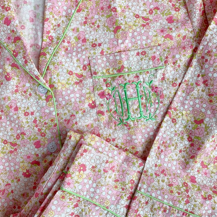 The perfect pajamas, period. With great style and coverage, this timeless pajama set in a Liberty floral cotton is lightweight and breathable. Piped in lime green, the traditional button-up shirt has a classic collar, cuffs and pants with a drawstring elastic waistband. Price includes Standard monogram. You may pick a premium or motif monogram for an added charge. Sizes XS, S, M, L, XL. If we are out of your size, let us know and we will order it! Spring Sleepover Cotton Sets, Spring Cotton Sleepwear For Home, Green Relaxed Fit Sleepwear For Spring, Relaxed Fit Green Sleepwear For Spring, Spring Cotton Daywear Sets, Spring Cotton Sets For Daywear, Green Cotton Sleepwear For Bedtime, Cotton Sets For Daywear In Spring, Green Cotton Spring Sleepwear