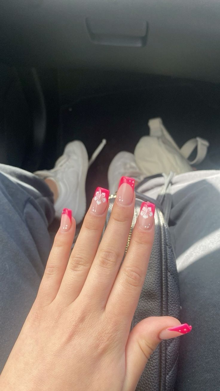 Pink French Tip With Hawaii Flower, Hawaii Nails Ideas Square, Nails With A Flower On One Nail, White French Tips With Hibiscus, Pink French Tip And Flower Nails, Nails With Hibiscus Flower Design, Summer Nails Flower French Tip, Hot Pink Hawaii Nails, Pink French Hibiscus Nails