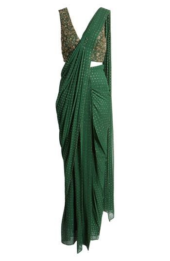 This saree has a hand-embroidered cropped top with intricate beadwork and lustrous sequins and is paired with a skirt featuring attached wraparound draping. Hidden side-zip closure V-neck Sleeveless Lined 100% viscose Spot clean Imported Asian & Pacific Islander Owned/Founded Traditional Embellished Pre-draped Saree For Festive Season, Green Blouse Piece For Evening With Traditional Drape, Designer Wear Draped Dupatta With Mirror Work, Designer Draped Dupatta With Mirror Work, Designer Mirror Work Draped Dupatta, Green Pre-draped Saree For Reception, Embellished Georgette Pre-draped Saree For Navratri, Draped Saree For Reception And Navratri, Unstitched Blouse Draped Lehenga In Georgette