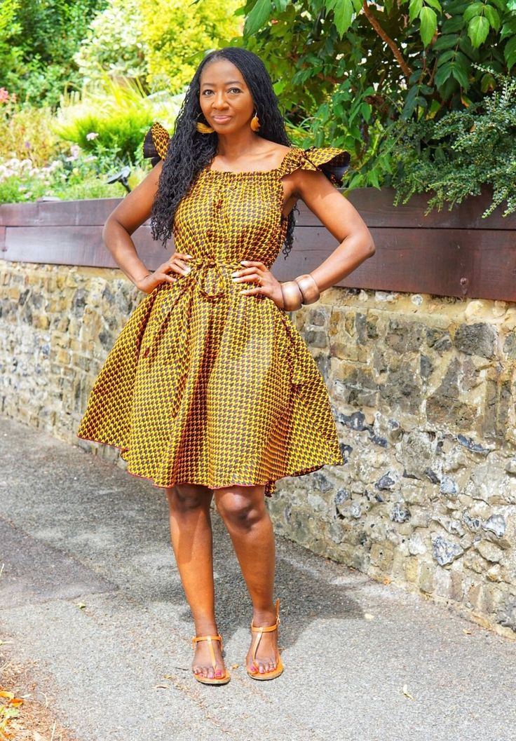 A fun playful sassy dress in a contemporary African print in muted brown and mustard tones. It is a full dress with a same fabric belt that may be worn with or without the belt and on or off shoulder. The cute ruffles sleeves are lined to give it body for a beautiful finish which enhances the entire look of the dress. Handmade in Ghana.  100% cotton. Length appx 39". Ruffles Sleeves, Muted Brown, Sassy Dress, Fuschia Dress, African Print Dress, Ankara Dress, Full Dress, Ruffle Sleeve Dress, Dress Handmade