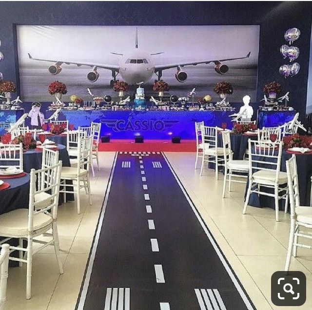 an airplane themed event with tables and chairs