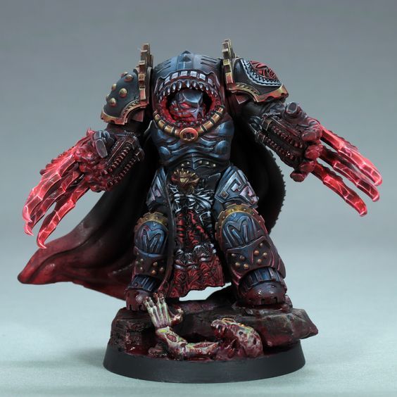 a painted warhammer with red paint on it's face and arms, standing in front of a gray background