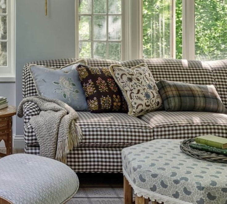 a living room filled with furniture and pillows