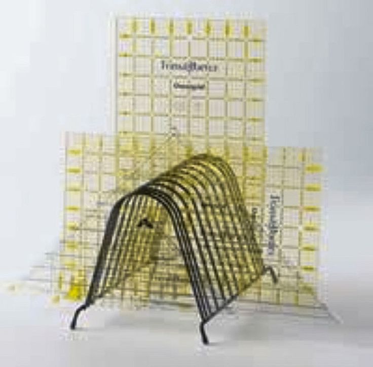 three books are stacked on top of each other in front of a white background with yellow squares