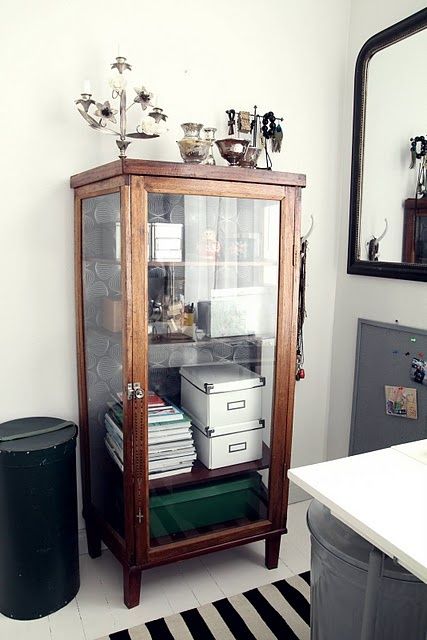 a glass cabinet filled with lots of items