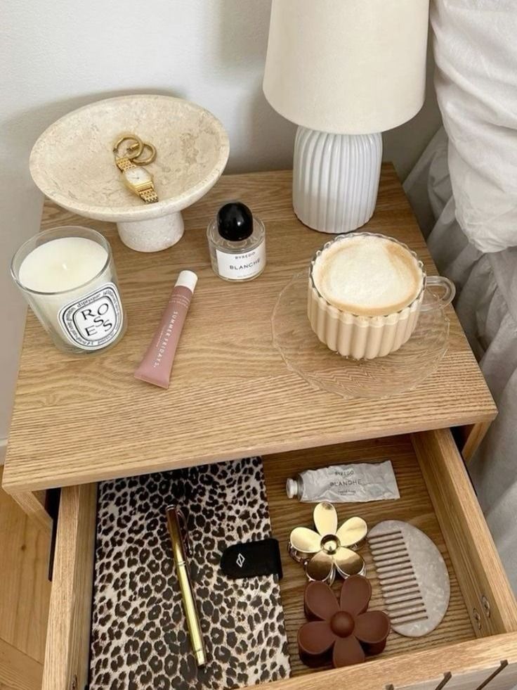 an open drawer with makeup and other items on it