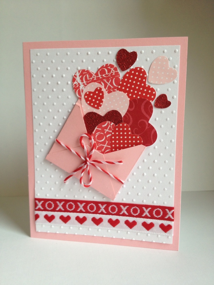 a valentine's day card with hearts and ribbons on the front, tied in a bow