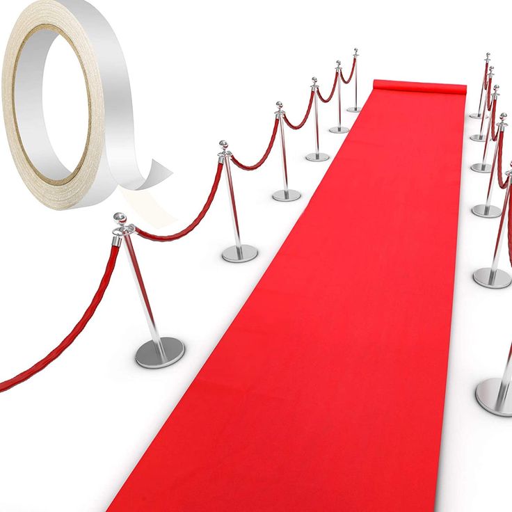 a red carpet and some silver poles with white tape on them next to each other