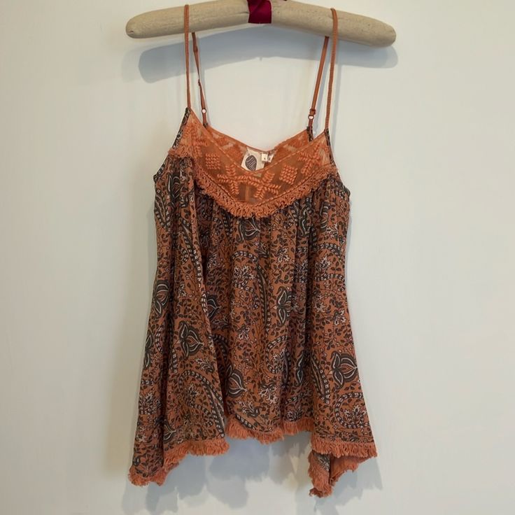 Nwt Anthropologie Camisole In A Coral, Grey And Cream Floral Pattern. Has A Uneven Fringe Hemline, Adjustable Spaghettis Straps And Beautiful Lace Detailing Around Neckline Sleeveless Beach Camisole With Built-in Bra, Vacation Tank Top With Adjustable Spaghetti Straps, Vacation Spaghetti Straps Tank Top With Adjustable Straps, Cotton Camisole With Tank Straps For Beach, Spring Beach Tops With Delicate Straps, Bohemian Beach Tops With Built-in Bra, Summer Camisole With Lace Trim And Tank Straps, Summer Tank Top With Delicate Straps, Summer Camisole With Delicate Straps For Vacation