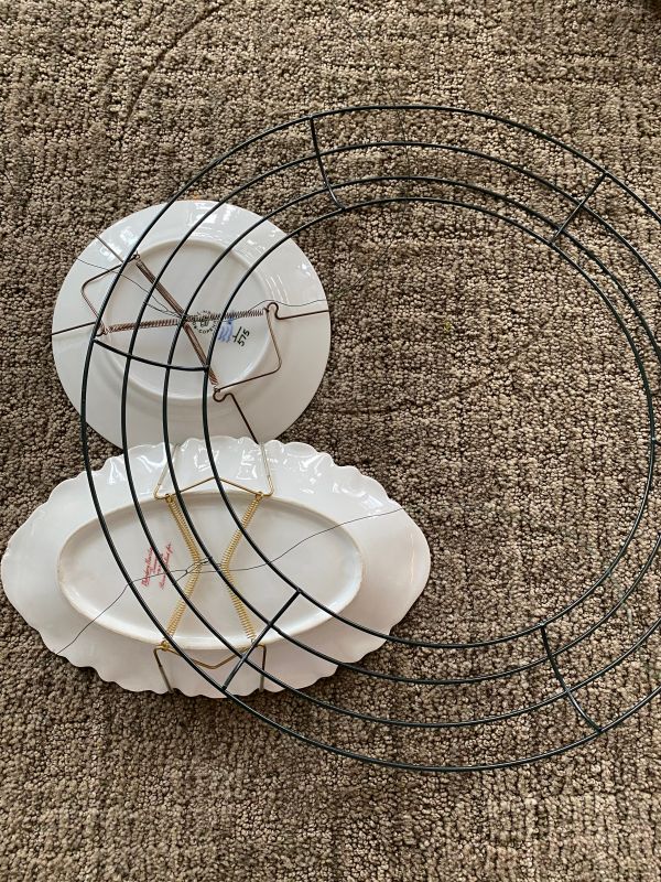 three plates stacked on top of each other in a circle with wire around them,