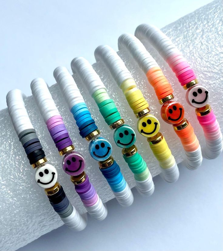 the bracelets are decorated with smiley faces