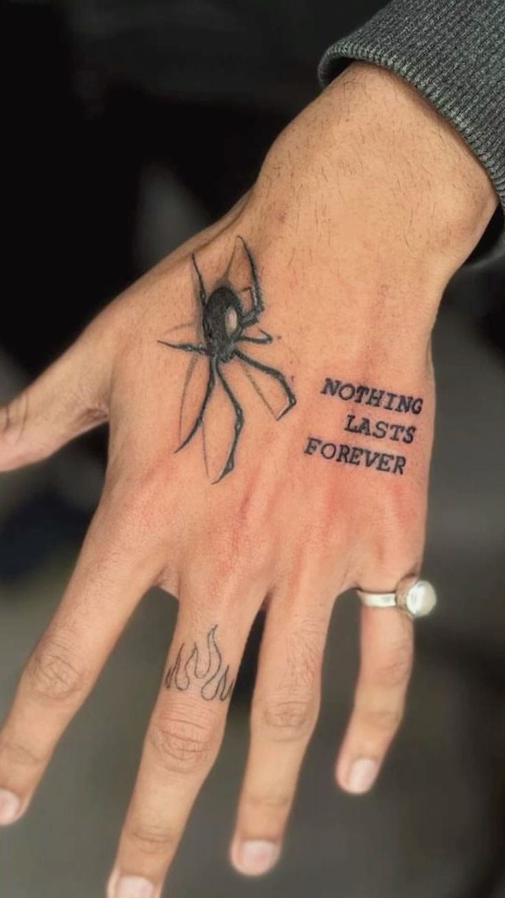 a person's hand with a spider on it and the words nothing last forever