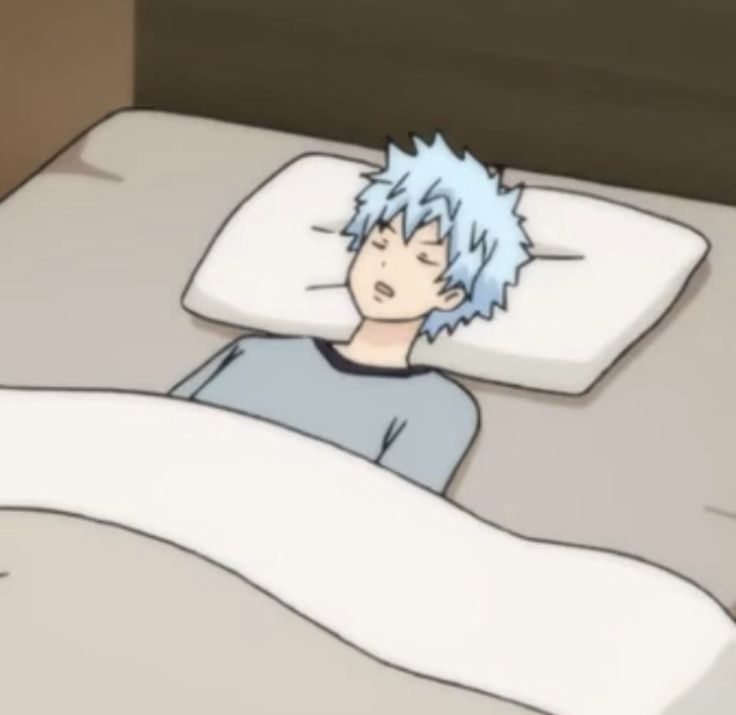 a person laying in bed with an unmade pillow