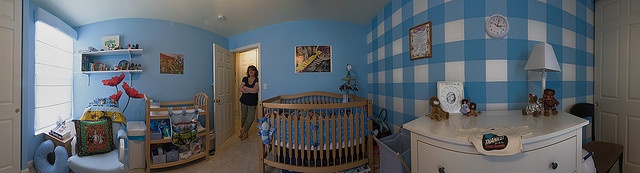 a child's room with blue and white walls