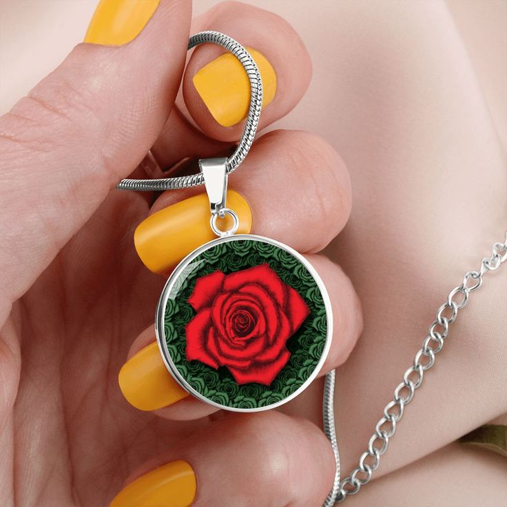 Red Rose Circle Pendant Necklace The Red Rose Circle Pendant Necklace is a beautiful and meaningful gift that can be given to that special person in your life. Whether it's your significant other, your best friend, or a family member, expressing love and support is always important, especially when they're going through a tough time. The red rose pendant is a symbol of many things such as romance, love, beauty, passion, and courage. It's a powerful reminder that love can conquer all, and that th Rose Red Jewelry For Valentine's Day Anniversary, Red Round Pendant Jewelry For Mother's Day, Personalized Rose Jewelry For Anniversary, Valentine's Day Flower Pendant Jewelry For Anniversary, Valentine's Day Rose Design Jewelry For Anniversary, Valentine's Day Anniversary Flower Pendant Jewelry, Silver Jewelry With Roses For Gift, Rose Jewelry For Valentine's Day, Rose-colored Jewelry For Valentine's Day Anniversary