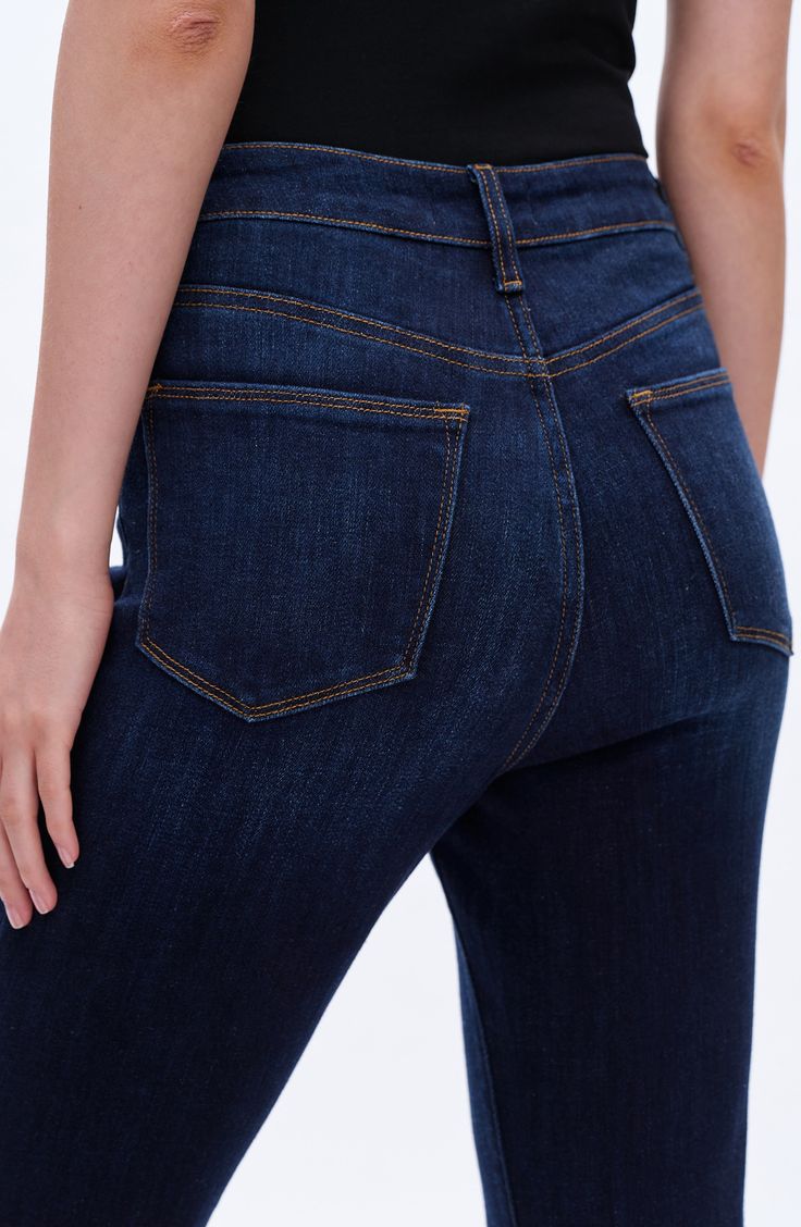 Wide flare legs add retro appeal to these high-waist jeans made from soft stretch denim in a classic dark-blue wash. 31 1/2" inseam; 21" leg opening; 11" front rise; 15" back rise Zip fly with button closure Five-pocket style 90% cotton, 8% polyester, 2% spandex Machine wash, tumble dry Imported Dark Wash Stretch High Rise Flare Jeans, Classic High Rise Denim Blue Flare Jeans, Stretch High Rise Flare Jeans In Dark Wash, Classic High Waist Dark Wash Flare Jeans, Classic High Rise Stretch Cropped Jeans, Classic High-rise Stretch Cropped Jeans, High Rise Dark Wash Flare Jeans, Fitted High Rise Cropped Jeans In Dark Wash, Classic High Rise Cropped Jeans In Dark Wash