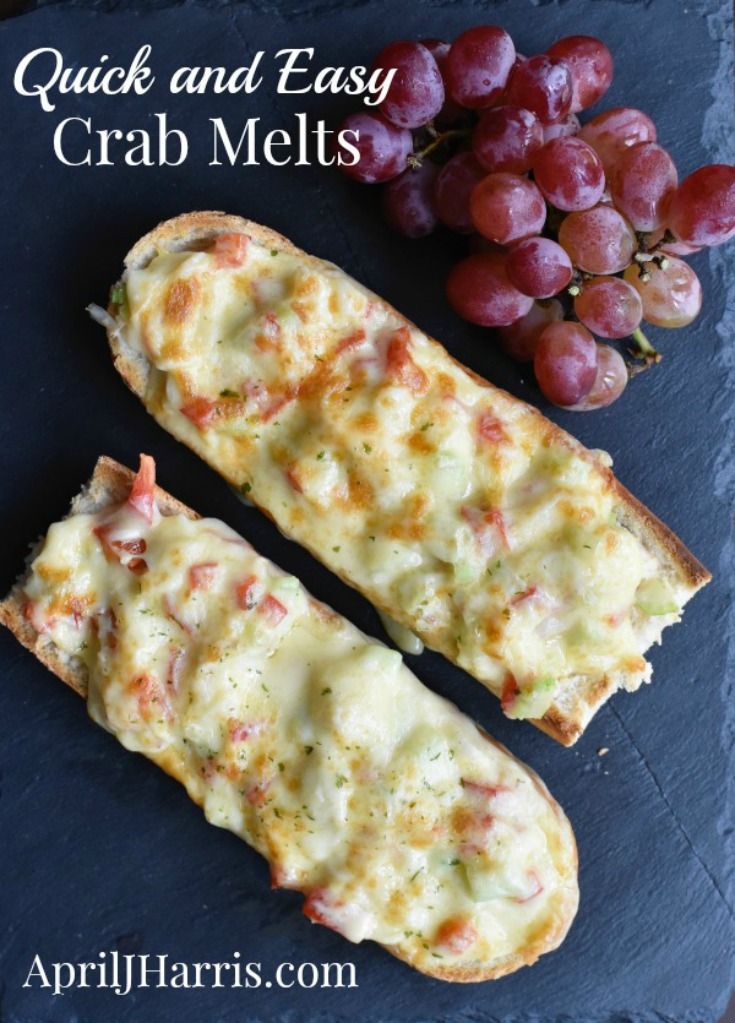 two pieces of bread with cheese and grapes