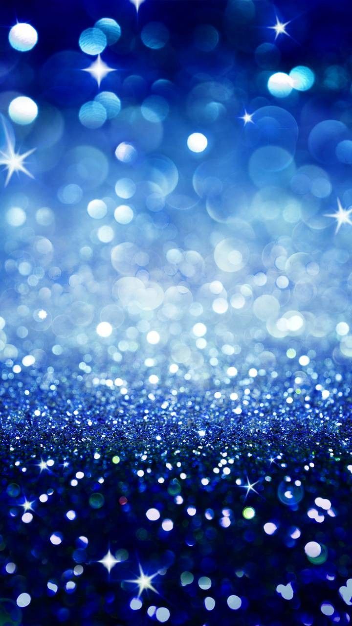 an abstract background with stars and sparkles in the dark blue night sky stock photo