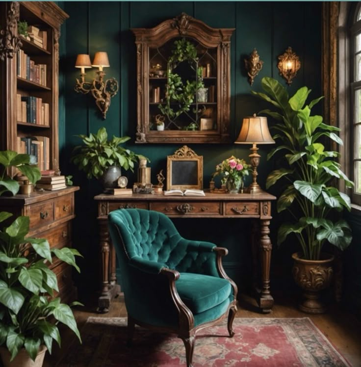 a green chair sitting in front of a desk next to potted plants and a mirror