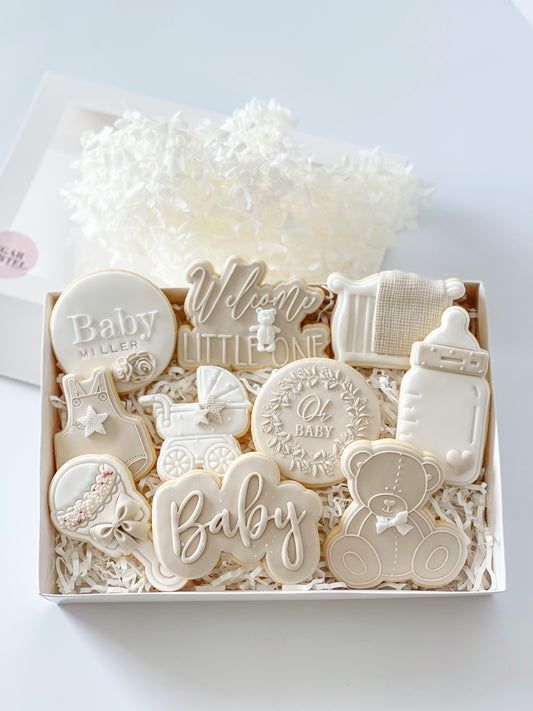 a box filled with lots of cookies on top of a table