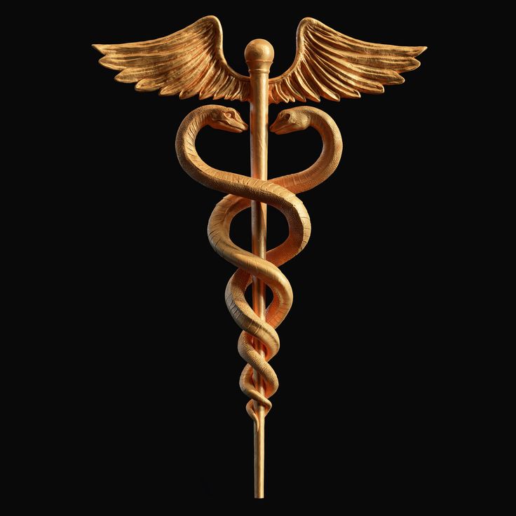 a golden cadus symbol with two snakes on it's back and wings, against a black background