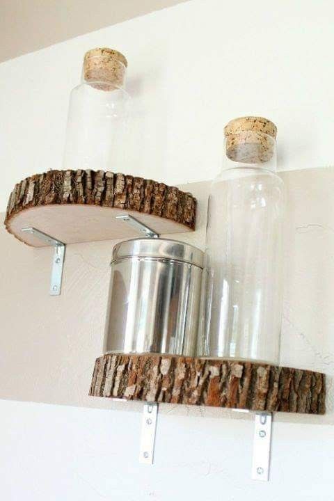 there are two glass bottles on the wall and one is made out of tree trunks