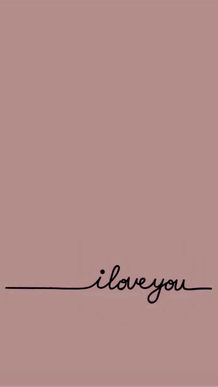 the word i love you written in black ink on a pink background