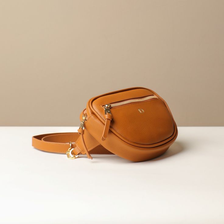 Introducing our stylish leather Belt Bag Juliana, designed for ultimate convenience and hands-free practicality. Crafted from high-quality leather, this bag features a secure zippered compartment, perfect for keeping your essentials organized and within easy reach. Ideal for those on the go, it combines functionality with a sleek design, making it a versatile accessory for any outfit. DETAILS Material: Premium, environmentally certified leather Zip closure, fabric lining Adjustable strap for wea Leather Belt Bag, High Quality Leather, Leather Belt, Belt Bag, Adjustable Straps, Sleek Design, Leather, Black