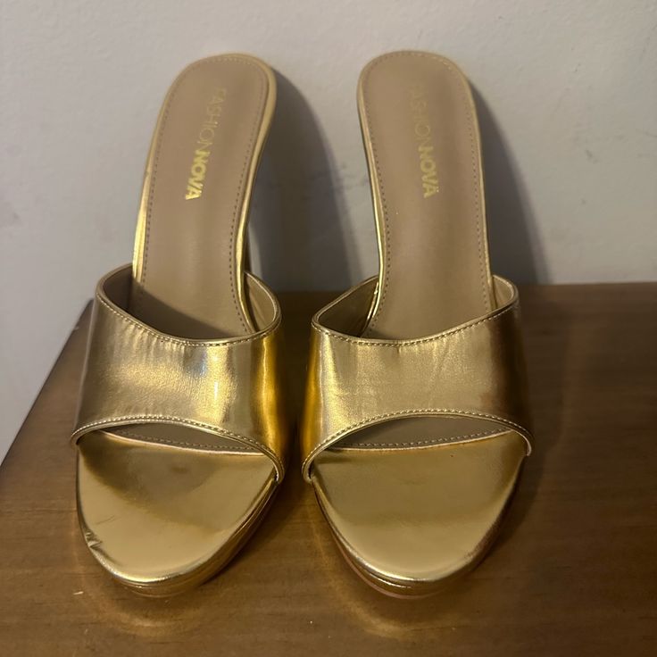 Gold Mules With A Platform Never Worn Gold Casual Heels With Closed Toe, Casual Gold Closed Toe Heels, Casual Gold High Heels, Gold High Heel Mules With 4-inch Heel, Gold Synthetic Closed Toe Heels, Gold Medium Width Slip-on Heels, Gold Almond Toe Sandals Medium Width, Gold Almond-toe Sandals Medium Width, Gold Synthetic Heels With Almond Toe