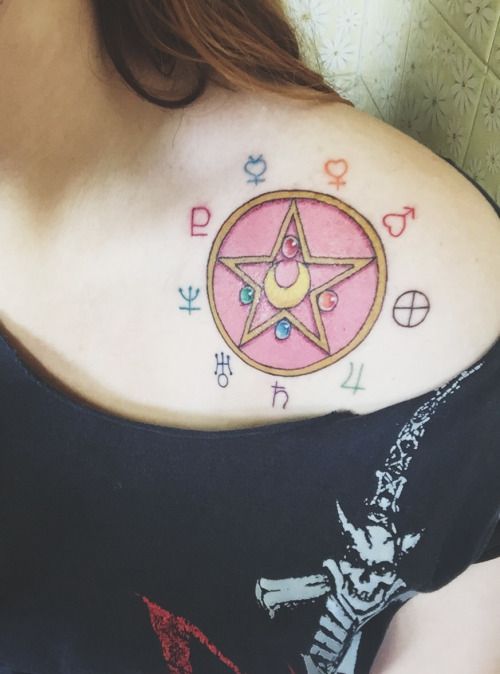 a woman with a star tattoo on her shoulder