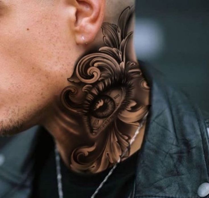 a man with a tattoo on his neck