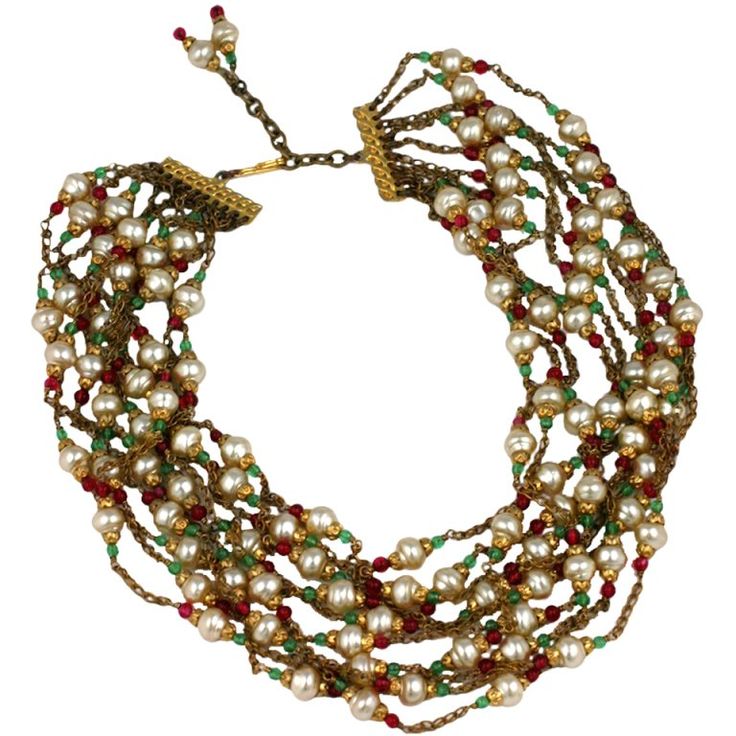 Chanel multi chain pearl, emerald and ruby handmade glass collar. Designed by Gripoix mid 1950s to look as though each strand is casually wrapped around the neck, a part of the Chanel idiom of an instictive effortless elegance. Unsigned 16-19" lengths, 2.5" width Many necklaces from the period become available in these wonderfully crude metal tones, not with the hypergilding used today. This heightens and reinforces the baroque aspect of the jewel as prescribed by Chanel's rich aesthetic. Gold Costume Jewelry, Walmart Jewelry, Antique Fashion, Vintage Beads Necklace, Costume Necklaces, Costume Jewelry Necklaces, Chanel Jewelry, Designer Fashion Jewelry, April 27