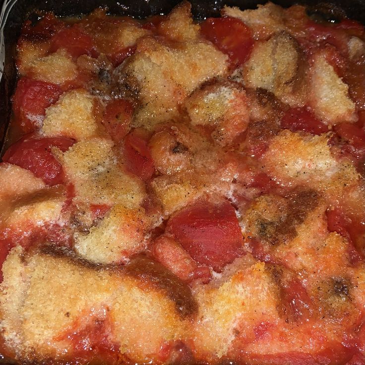 a casserole dish with meat and vegetables in it