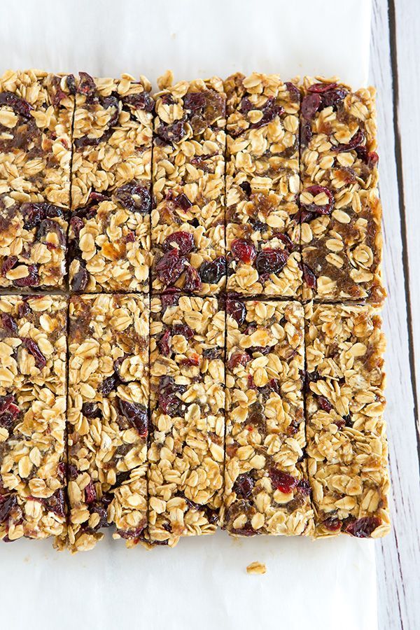 granola bars cut into squares and stacked on top of each other