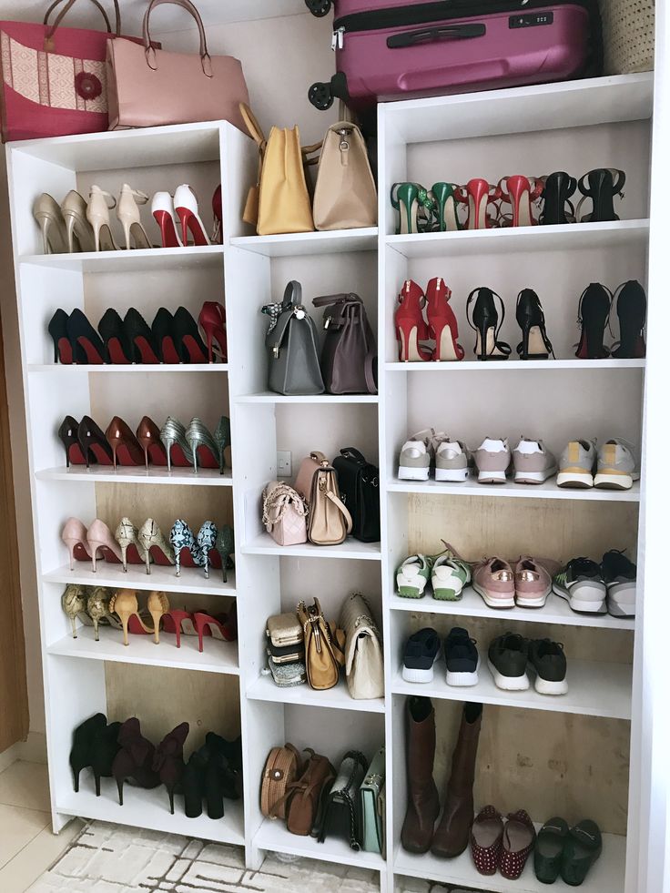 a closet filled with lots of shoes and purses