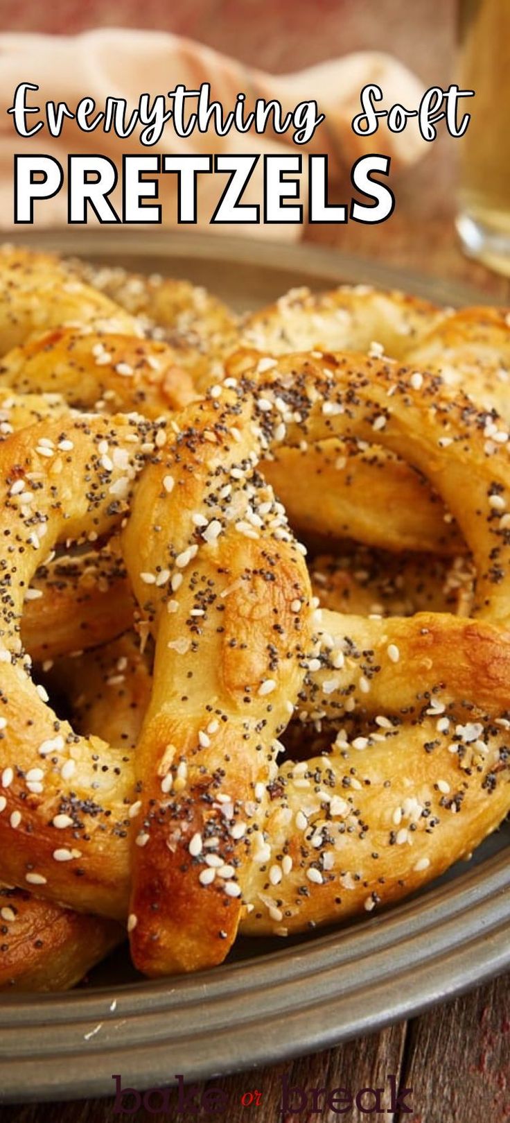 an image of pretzels on a plate with sesame seed sprinkles