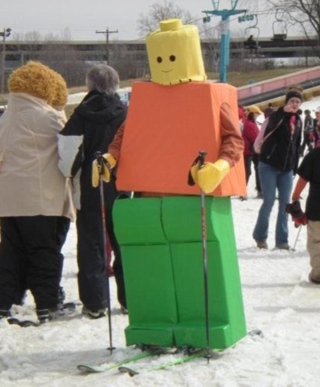 a group of people standing in the snow wearing legos and holding ski poles,