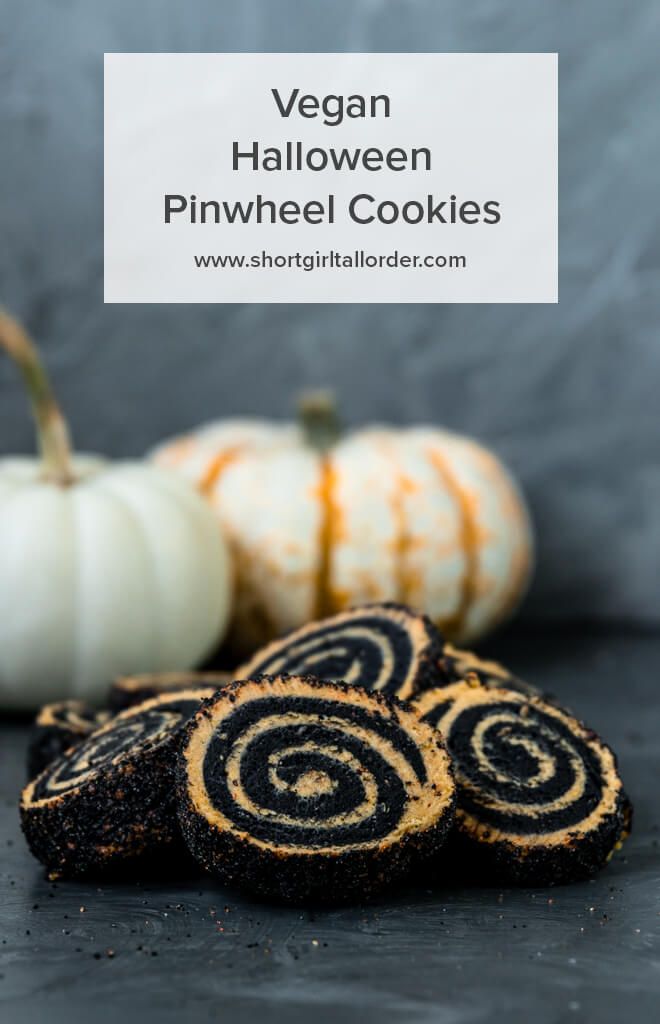 vegan halloween pinwheel cookies with pumpkins in the background