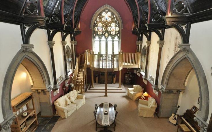 an aerial view of a living room with couches and tables