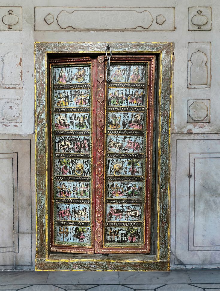 an ornate wooden door with intricate designs on it