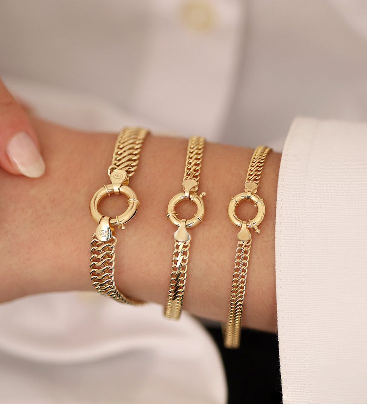 "The 14k Gold Vienna Chain Charm Bracelet is a truly special piece of jewelry. It's rooted in the long-standing tradition of charm bracelets, each charm symbolizing an aspect of life or a personal memory. Made from lustrous 14 karat gold, the bracelet's unique Vienna chain design is both sturdy and aesthetically pleasing, ensuring it will last for years to come. Each charm on this bracelet holds its own meaning. The ship wheel signify a love for adventure and travel, the heart and key symbolize 14k Gold Jewelry With Lobster Clasp For Gift, Gold Anniversary Bracelet With Lobster Clasp, Tarnish Resistant Charm Bracelet For Anniversary, Fine Jewelry Curb Chain Bracelet As Gift, Fine Jewelry Curb Chain Bracelet Gift, Fine Jewelry 14k Gold Chain Bracelet For Anniversary, 14k Gold Charm Bracelet For Anniversary, Gold Plated Curb Chain Bracelet As Gift, 14k Gold Fine Jewelry Chain Bracelet For Anniversary