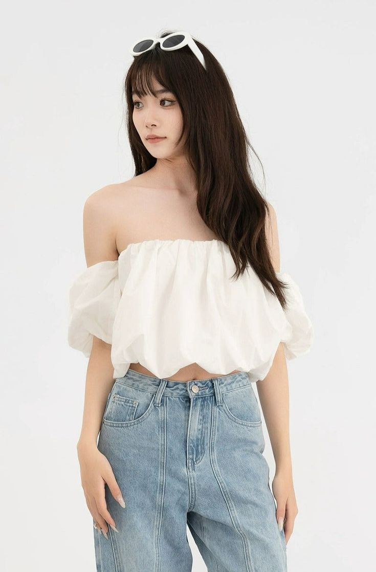 Embrace a touch of French-inspired fashion with our Ruffled Off-Shoulder Puff Sleeve Crop Top—an essential piece for your summer collection. Artfully crafted from 100% cotton, this top features a charming one-shoulder neckline and playful puff sleeves that add a whimsical twist to your ensemble. It's finished with a super short hemline, creating a silhouette that’s both flirtatious and on-trend. Pair it with high-waisted jeans or a sleek skirt for day events, or amp up the drama with statement a Chic Cotton One Shoulder Top For Summer, Trendy Summer Off-shoulder Top, Feminine Puff Sleeve Crop Top For Summer, White Cotton One Shoulder Top For Summer, Trendy Cotton One Shoulder Top For Summer, Trendy One Shoulder Crop Top For Spring, Trendy Off-shoulder Top For Summer Day Out, Chic Summer Crop Top With Puff Sleeves, Cotton One Shoulder Top For Summer