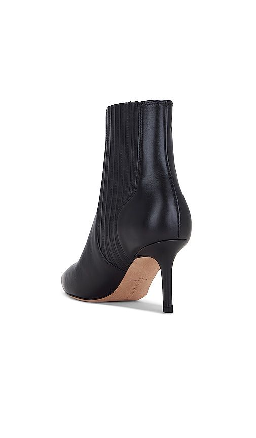 Find VERONICA BEARD Lisa 70 Bootie on Editorialist. Veronica Beard Lisa 70 Bootie in Black. - size 5 (also in 6, 7, 7.5, 8) Veronica Beard Lisa 70 Bootie in Black. - size 5 (also in 6, 7, 7.5, 8) Leather upper with leather sole. Made in China. Pull-on styling with concealed gore side panels. Leather footbed and lining. Pointed toe with stiletto heel. Approx 70mm/ 2.75 inch heel Approx 133mm/ 5.25 inch shaft. VBRD-WZ122. I6809L2. Veronica Beard is an elevated American women's wear brand that strikes a balance between classic chic and laidback cool. Veronica Miele Beard and Veronica Swanson Beard are sisters-in-law who launched their brand together in 2010 with a modern perspective on iconic staples. The brand developed the Dickey Jacket as its first must have piece under the concept of chic Flare Jeans Shoes, Black Heel Boots, Black Ankle Booties, Women's Wear, Classic Chic, Shoes With Jeans, Veronica Beard, Suede Ankle Boots, Shoes Booties