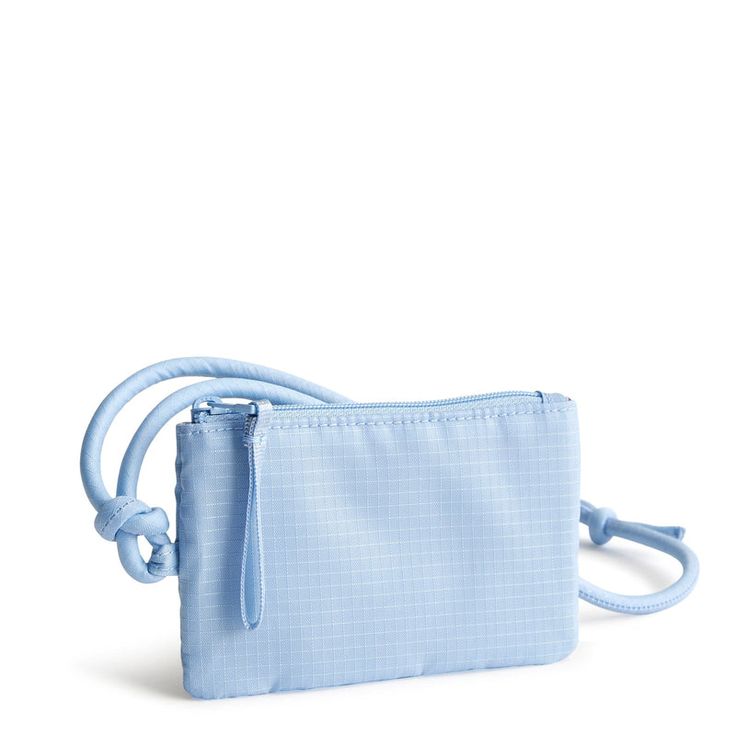 Keep your essentials close at hand with our Zip Card Pouch Lanyard. Perfect for those who want to travel light and hands-free, this stylish accessory combines the convenience of a card case with the functionality of a lanyard, allowing you to carry your cards and ID with ease wherever you go. Vera Bradley Zip Card Pouch Lanyard in Blue Functional Blue Pouch Travel Accessories, Light Blue Rectangular Travel Wallet, Versatile Blue Phone Bag For Travel, Blue Travel Pouch With Cell Phone Pocket, Blue Zipper Pouch Travel Accessories For Everyday Use, Blue Everyday Travel Accessories With Zipper Pouch, Travel Wallet With Zipper Pouch In Blue, Functional Blue Packable Travel Accessories, Blue Travel Pouch Phone Bag