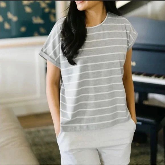 Chic, Boxy, And Deceptively Simple, This Flattering T Is The Staple Item You’ve Been Missing. Its Classic Hem Length, Breathable Fabric, And Minimalist Cap Sleeves Make It A Flexible, Versatile Addition To Your Winter Layers And To Your Summer Wardrobe. Boxy, Relaxed Cut Falls To The Upper Hip. Rolled-Edge Cap Sleeves, Sewn In Place. Soft, Breathable Fabric With Two-Way Stretch. Double Top-Stitched Finishes. Sweat-Wicking, Quick-Drying Fabric Blend. Reflective Moon Detail. Fits True-To-Size, Rel Relaxed White Tops For Layering, Relaxed White Top For Loungewear, Striped Cotton Tops For Loungewear, Striped Relaxed Fit Top For Loungewear, Gray Crew Neck Tops For Day Out, Preppy Logo, Winter Layers, Tie Dye Women, Moon Shirt