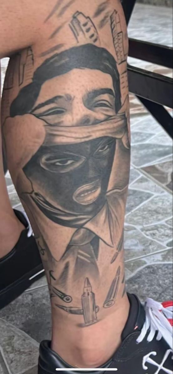 a man with a mask on his leg