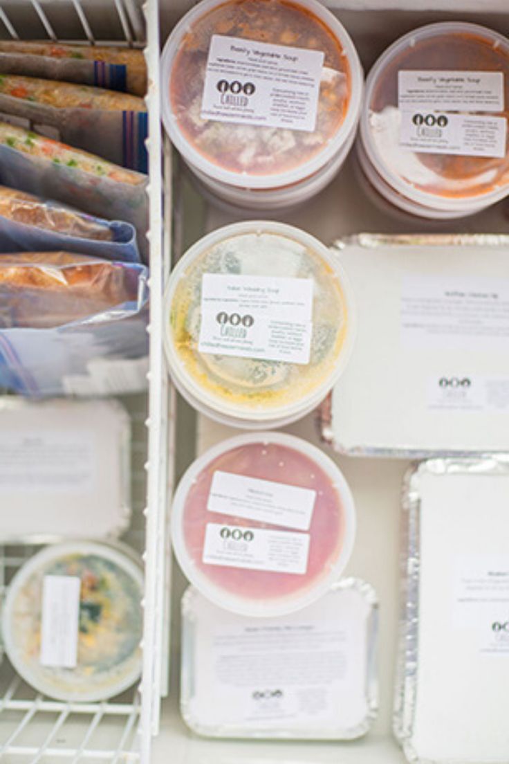 the shelves are filled with different types of food in plastic cups and containers, all labeled with labels on them