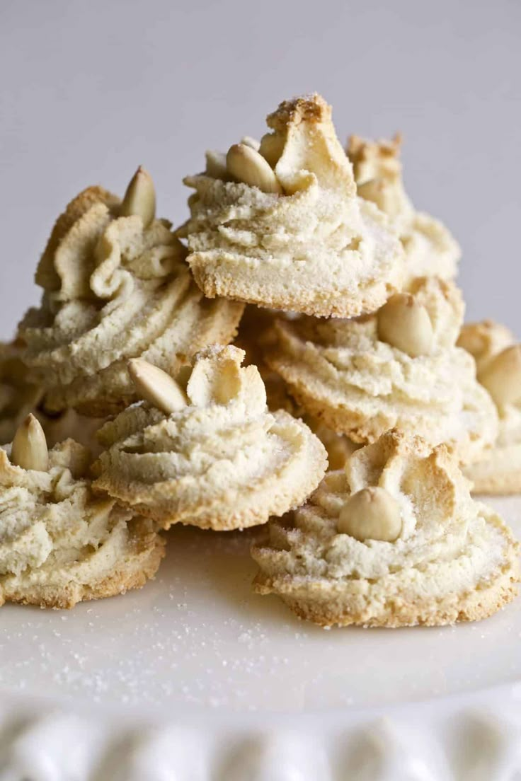 a pile of cookies sitting on top of a white plate